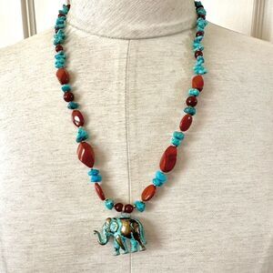 Brass elephant pendant necklace with carnelian, turquoise and red jasper beads